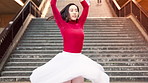Woman, ballet and dancer with talent in city by stairs with steps, balance and rhythm in street. Person, dancing and tutu for art with moving, concert and performance on urban sidewalk in Japan