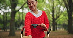 Walking, relax and Asian woman with dog in park with pet stroller for fresh air, adventure and peace. Happy, animal care and Japanese person with Beagle in nature for wellness, health and travel