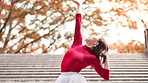 Japanese, woman and ballet dancing on city steps with balance, moving and public performance. Creative, dancer and autumn with Asian culture, tradition and celebration custom on stairs with music