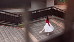 Ballet, dancer and Asian woman spin on stairs for performance, dancing and practice in city. Creative choreography, entertainment and ballerina in Japan for movement, balance and artistic talent