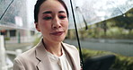 Rain, phone text and Japanese woman with umbrella and professional on morning commute in city. Web, outdoor and cold weather on urban street with social media, travel and Tokyo trip in storm