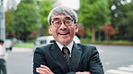 Happy, crossed arms and face of Japanese businessman in city waiting for public transportation. Smile, confident and portrait of mature male finance executive with pride for commuting in town.