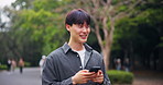 Japan, funny and man with smartphone, walking and laughing with meme, social media and typing. Asian guy, outdoor and person with smile, cellphone and joke with joy, humor or network with digital app