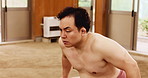 Japanese, sumo and man with wrestling for sports, muscle development and technique for fighting. Ground, male person and wrestler with balance for tournament, martial arts or asian tradition in dohyo
