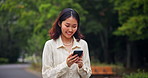Japan, funny and woman with smartphone, walking and humor with meme, social media and network. Asian girl, outdoor and person with cellphone, app or joke with joy, laughing and break with connection