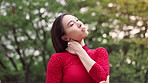 Dancer, neck pain and Asian woman in park with stress for performance, dancing and ballet routine outdoors. Creative, artist and Japanese person with tension, muscle strain and inflammation in nature
