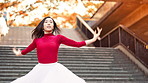 Woman, dancing and ballet on stairs in city with moving, balance and rhythm for street art with pride. Person, dancer and outdoor on steps with spin, concert or performance on urban sidewalk in Japan