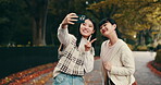 Japanese women, friends and selfie for bonding together, walking or outdoor with peace sign. Female people, happiness and smile as post for memory, relax or social media app in park, garden or nature