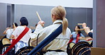 Taiko, instrument and people playing drums in studio for performance practice, festival rehearsal or culture. Back, women band or Japanese drummer group with bachi percussion for sound entertainment