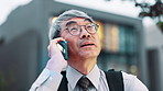 Phone call, talking and Asian businessman in city for contact on commute, travel and trip. Professional, corporate and mature Japanese person on smartphone for communication, networking and chat