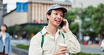 Man, phone call and travel in city, talking and happy with coffee on walk, outdoor and contact in street. Person, smartphone and smile with chat, conversation and commute on urban sidewalk in Japan