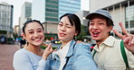 Friends, selfie and face in city for travel, smile and funny with sign, smile or photography on commute in street. People, group and happy for memory, tourism and profile picture on sidewalk in Japan