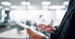 Hands, tablet and person in office with typing in corridor, scroll and problem solving with app at company. Japanese employee, touchscreen and review for feedback with project at insurance agency