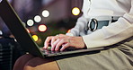Woman, hands and typing with laptop at night for communication, email or business travel in Japan. Closeup, female person or freelancer working late on computer for online browsing in city or town