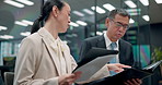 Man, woman and discussion with documents in office, reading and review for project at insurance agency. Japanese business people, secretary and boss with folder, paperwork and feedback at company