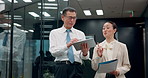 Man, woman and tablet with documents in office, corridor or review for project at insurance agency. Japanese business people, secretary and boss at night, paperwork and digital touchscreen at company
