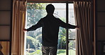 Open curtains, back and man in house, morning and start day with sunlight, calm and Japanese. Person, apartment and guy with weekend break, wake up and relax with window, comfort and accommodation