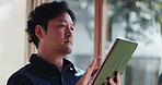 Thinking, tablet and Asian man in home for remote work, connection and networking. Living room, freelancer and Japanese person on digital tech for website, research and reading online news in morning