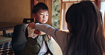 Child development, growth or learning with mother and son in home for autism or motor skills. Coordination, dexterity and mobility with woman teaching Japanese boy in apartment for improvement