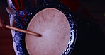 Taiko drums, Japan and woman with instrument, ceremony and celebration with ritual. Closeup, person and musician with sticks, music and sound with skill, talent and culture with traditions and audio