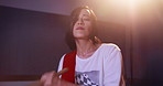 Taiko drumming, playing and woman in festival, talent and professional with sticks for performance. Serious, artist and Japanese person with instrument, religion and music for cultural event in Japan