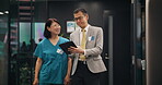 Nurse, person and walking with tablet in hospital for health management or staff service delivery. Medical administration, japanese people and digital policy to monitor performance or clinic schedule