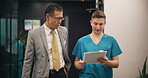 Hospital, doctor and nurse walking with clipboard for medical results, healthcare feedback and patient chart. Professional, mature mentor and paperwork for research update and health support in Japan