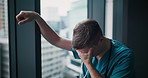 Frustrated man, nurse and fail with window for mistake, loss or grief in fatigue or depression at hospital. Sad, male person or doctor with bad news for negative results, stress or emotion in Japan
