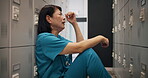 Crying, stress and doctor with Japanese woman in locker room for depression, mental health and frustrated. Burnout, fatigue and bad news with profile of person in hospital for medical emergency
