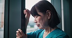 Frustrated woman, nurse and fail with window for mistake, loss or grief in fatigue or depression at hospital. Japanese, female person or doctor with bad news for negative results, stress or emotion