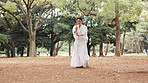 Samurai, woods and woman with fitness in park with wood sword, warrior and fight training outdoor. Tradition, Japanese and fighter with weapon, sport and battle performance of martial arts in Tokyo