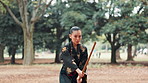 Martial arts, japanese woman and bamboo weapon for kendo in forest with traditional practice or skill development. Culture, serious samurai and sword for fighting technique, self defense and attack