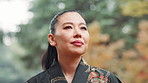 Woman, thinking and kimono in park with traditional clothes, outdoor and memory with reflection for gratitude . Person, inspiration and perspective in morning, travel and woods with style in Japan