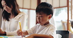 Japanese, kid and mom with writing in home for homework, family and education notes with knowledge. Online, website and youth development with project, care and support in living room and help