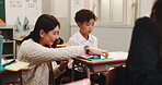 Japanese, student and teacher with helping for education, learning or assistance for academic test. School, boy learner or educator with communication in classroom, teaching or support with knowledge
