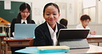 Face, girl and tablet in class for research, education and math skills development. Japanese child, happy student or technology in academy for elearning app, online resources or innovation for growth
