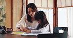 Writing, homework and Asian mom with child in home for learning, teaching and studying together. Family, education and Japanese mother help kid with books for school project, knowledge or development