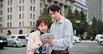 Tablet, city and business people together in street with web search, typing location and help with online travel booking. Professional, colleagues and checking transport schedule to commute in Japan