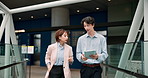 Walking, city and Asian business people with tablet for meeting, discussion and planning on bridge. Corporate, travel and Japanese man and woman on digital tech for teamwork, website and research