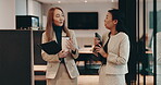 Business people, coffee and talking in office for collaboration, planning or feedback with documents. Women, Japan and discussion in workplace for teamwork, project management or development proposal