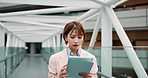 Tablet, business woman and walking in office for networking, email and notification in airport. Digital technology, work and Japanese person on internet, news update or travel agent with booking app
