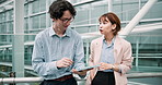 Meeting, city and Asian business people with tablet for talking, discussion and planning on bridge. Corporate, building and Japanese man and woman on digital tech for teamwork, website and research