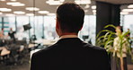 Man, business and walking with back in office for new day, morning and work ambition. Mature CEO, elevator and company floor in Japanese call center with schedule, confidence or pride for development