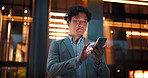 City, phone and Asian man at night for business communication, typing email and social media. Professional, corporate and Japanese worker on smartphone for transport service, contact and networking