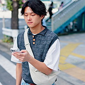 City, walking and phone text of japanese man with social media, scroll ...