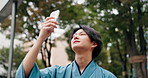 Japanese man, selfie and traditional clothes with smile, montsuki and post with low angle in nature. Person, photography or profile picture with memory, happy and kimono for social media in morning