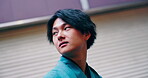 Building, travel and Asian man in city, thinking and traveller with traditional clothes, fashion and holiday. Serious, tourist and person with kimono, outdoor and tourism for vacation, trip and Japan