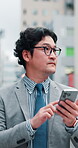 Travel, walking and businessman with smartphone, directions and searching for location and commuting. Outdoor, digital and mobile app with map, online and Japanese person with appointment in Tokyo