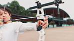 Archery, aim and woman with outdoor training, target practice and professional Japanese athlete. Bow, arrow and girl archer with sports challenge, shooting and precision performance at kyudo club