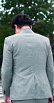Business man, travel and walking in road for commute, location and journey to workplace with bag. Executive, back and corporate trip outdoor for work destination, morning and career in Japan street